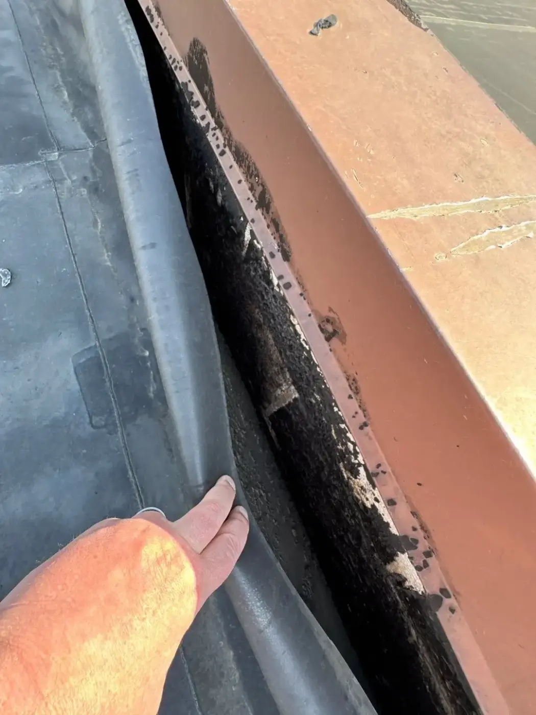 Tarping and dry-in on a Lowell commercial roof